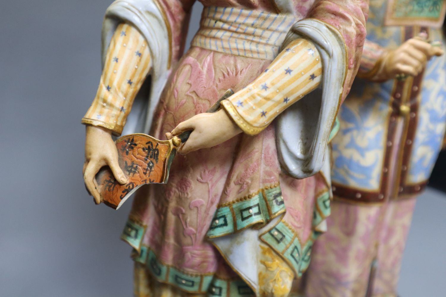 A pair of 19th century coloured bisque porcelain Oriental figures, height 38cm